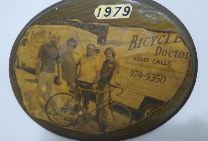 bicycle maintenance and repair - cleaning and oiling mountain bike chain and gear with oil spray